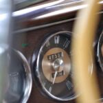 Close-up of vintage car dashboard speedometer gauges