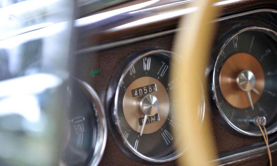 Close-up of vintage car dashboard speedometer gauges