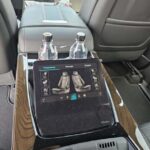 Luxury car rear console touchscreen with seat controls