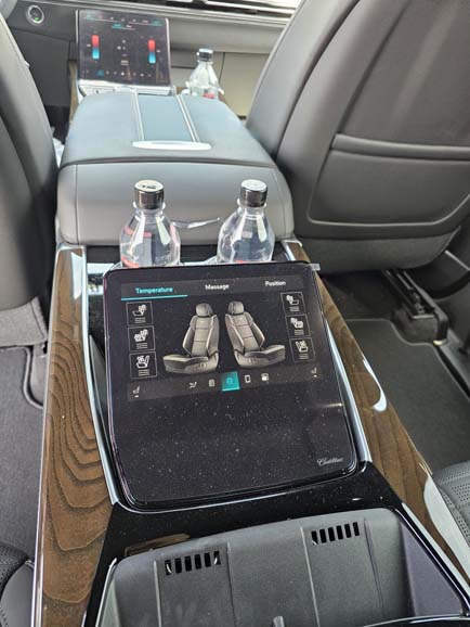 Luxury car rear console touchscreen with seat controls