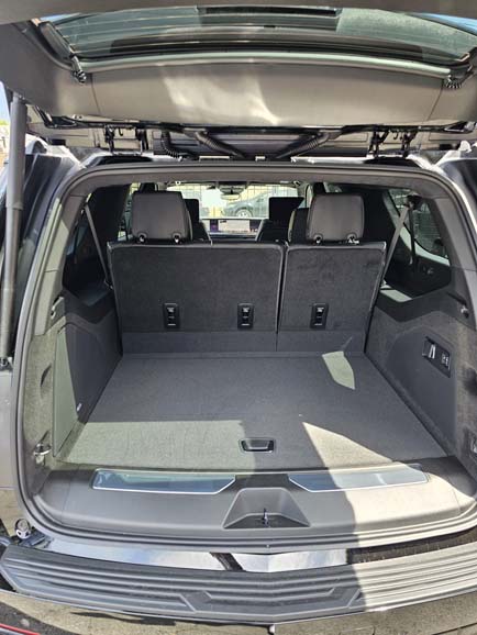 Open SUV trunk with rear seats upright