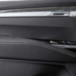 Black leather car door panel with controls