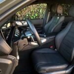 Modern car interior with black leather seats