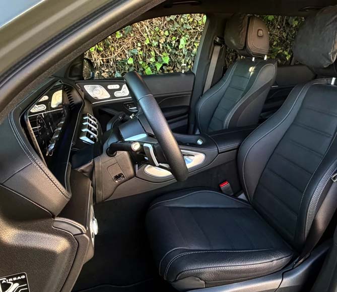 Modern car interior with black leather seats