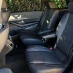 Black leather rear car seats with armrests