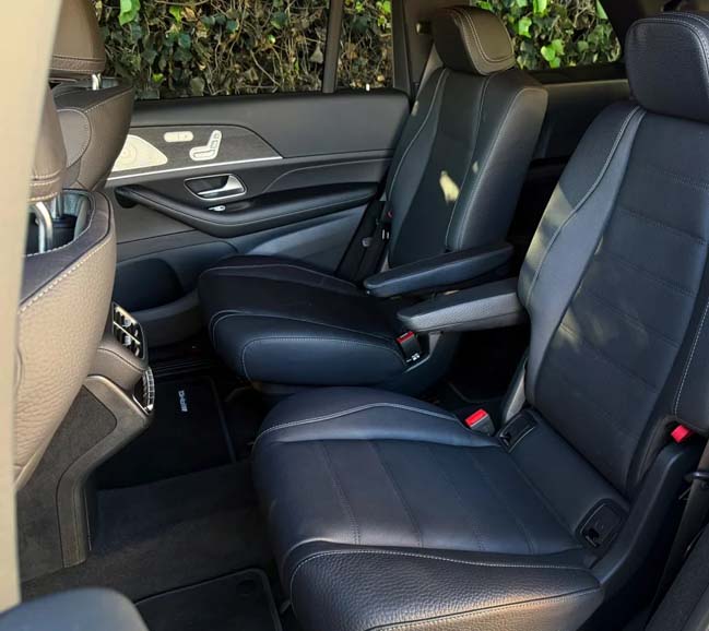 Black leather rear car seats with armrests