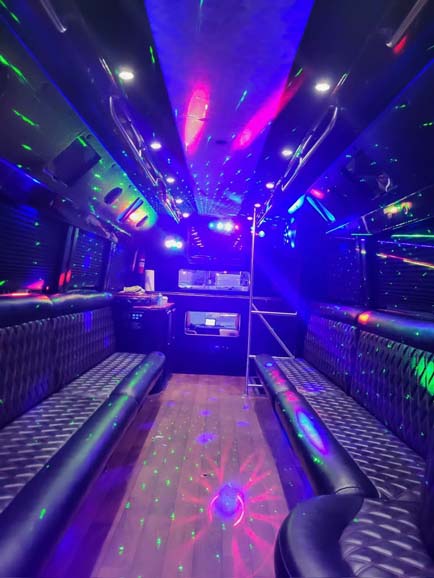 Luxury party bus interior with colorful LED lights