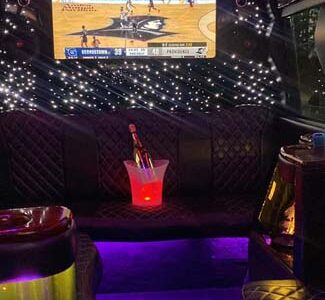 Luxury limo interior with TV and champagne