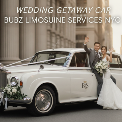 Bride and groom waving from vintage wedding car