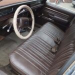Vintage car interior with brown bench seat