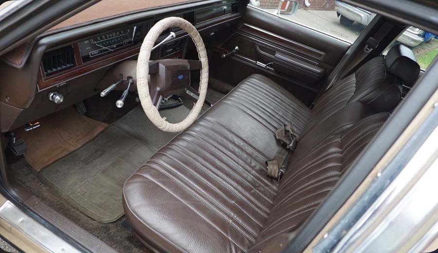 Vintage car interior with brown bench seat