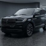 Black luxury SUV displayed in a modern showroom