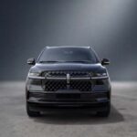 Front view of a black Lincoln SUV in studio