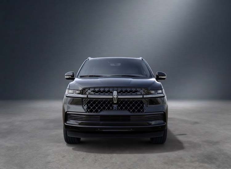 Front view of a black Lincoln SUV in studio