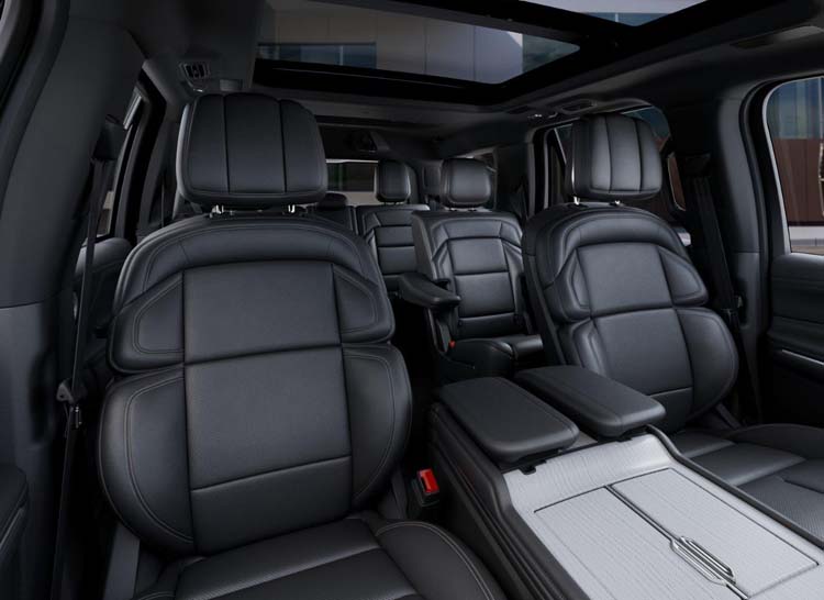 Luxury SUV interior with black leather seats and panoramic sunroof
