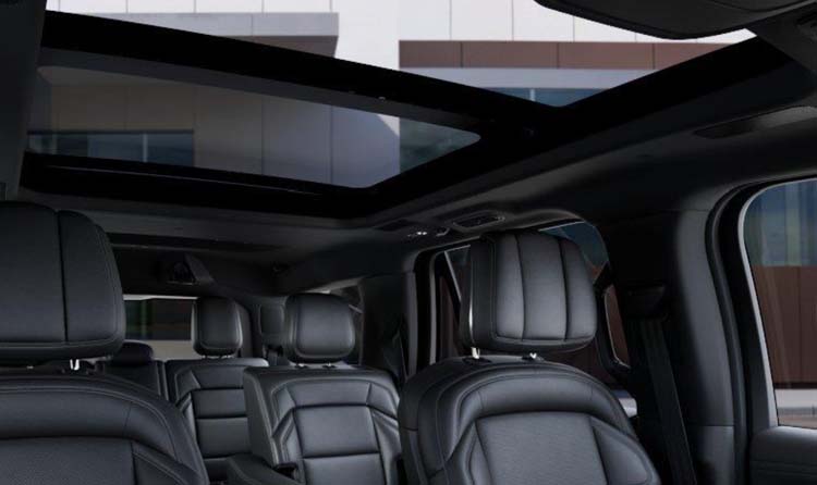 Black leather SUV interior with panoramic sunroof