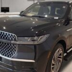Black Lincoln Navigator luxury SUV displayed in showroom