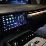 Modern car dashboard with dual screens and center console controls