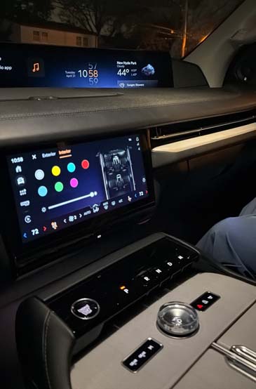 Modern car dashboard with dual screens and center console controls