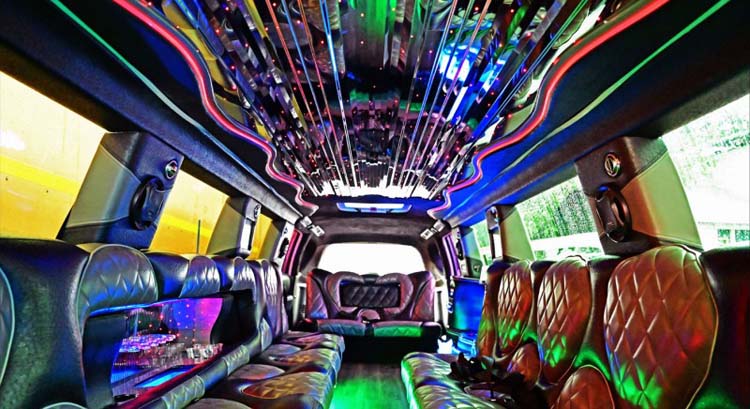 Colorful LED-lit limousine interior with leather seating