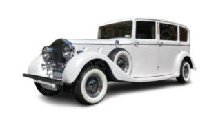 White vintage luxury sedan with whitewall tires