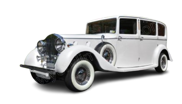 White vintage luxury sedan with whitewall tires
